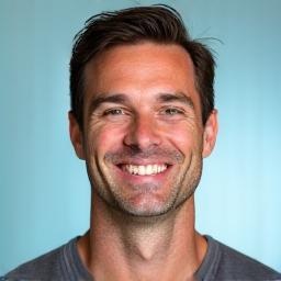 Professional headshot of Mark Davis, a cheerful man with a welcoming smile.